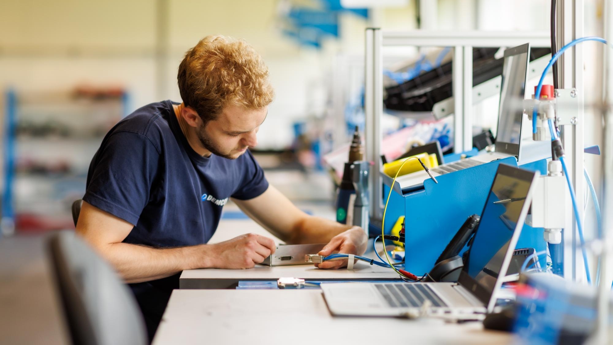 male_technician_manufacturing_module_cables